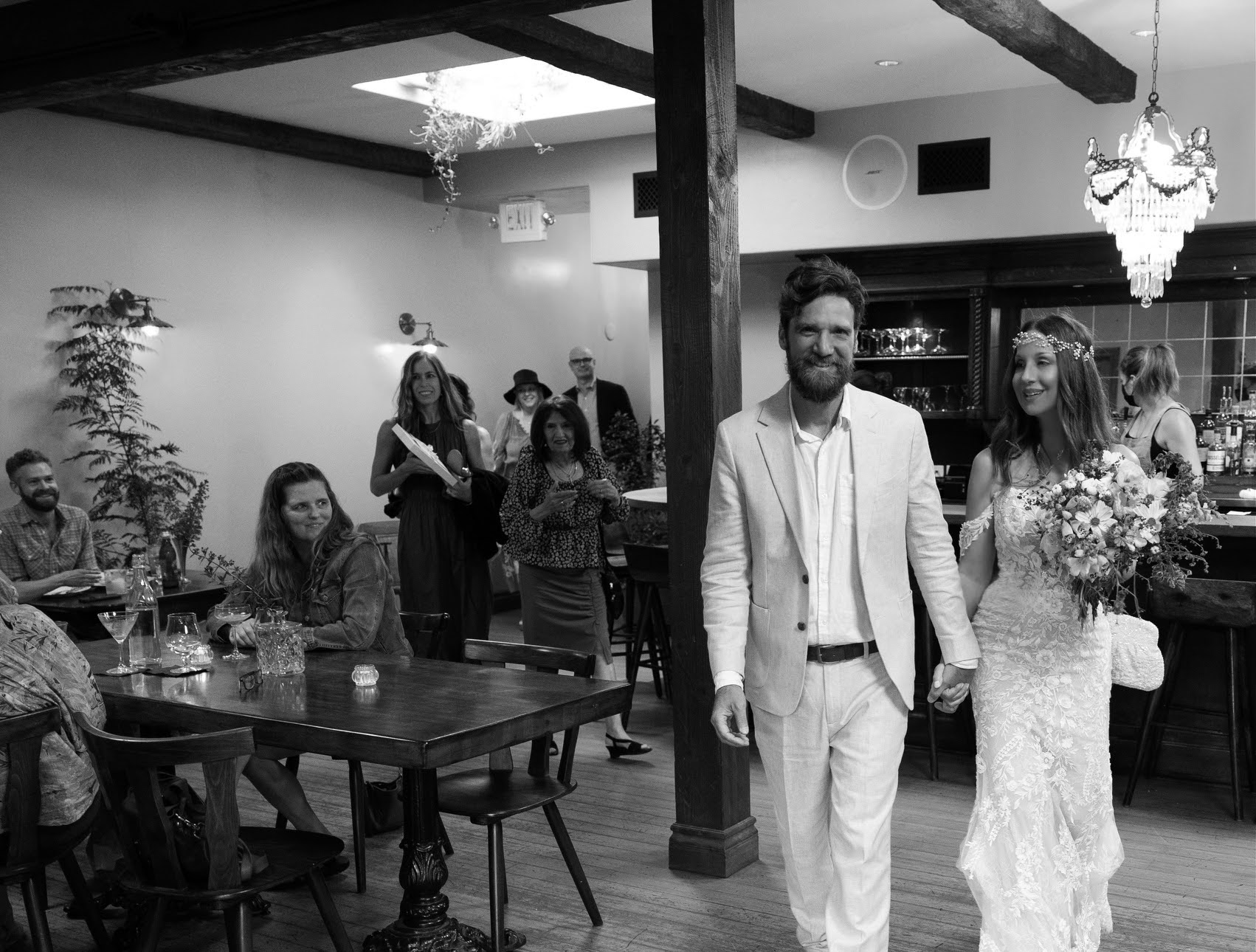 Photo of a wedding reception in the back bar.