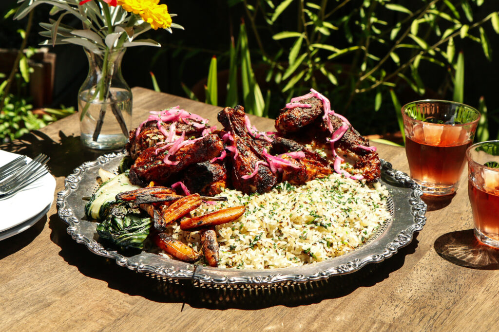 A large platter of tandoori chicken & rice.